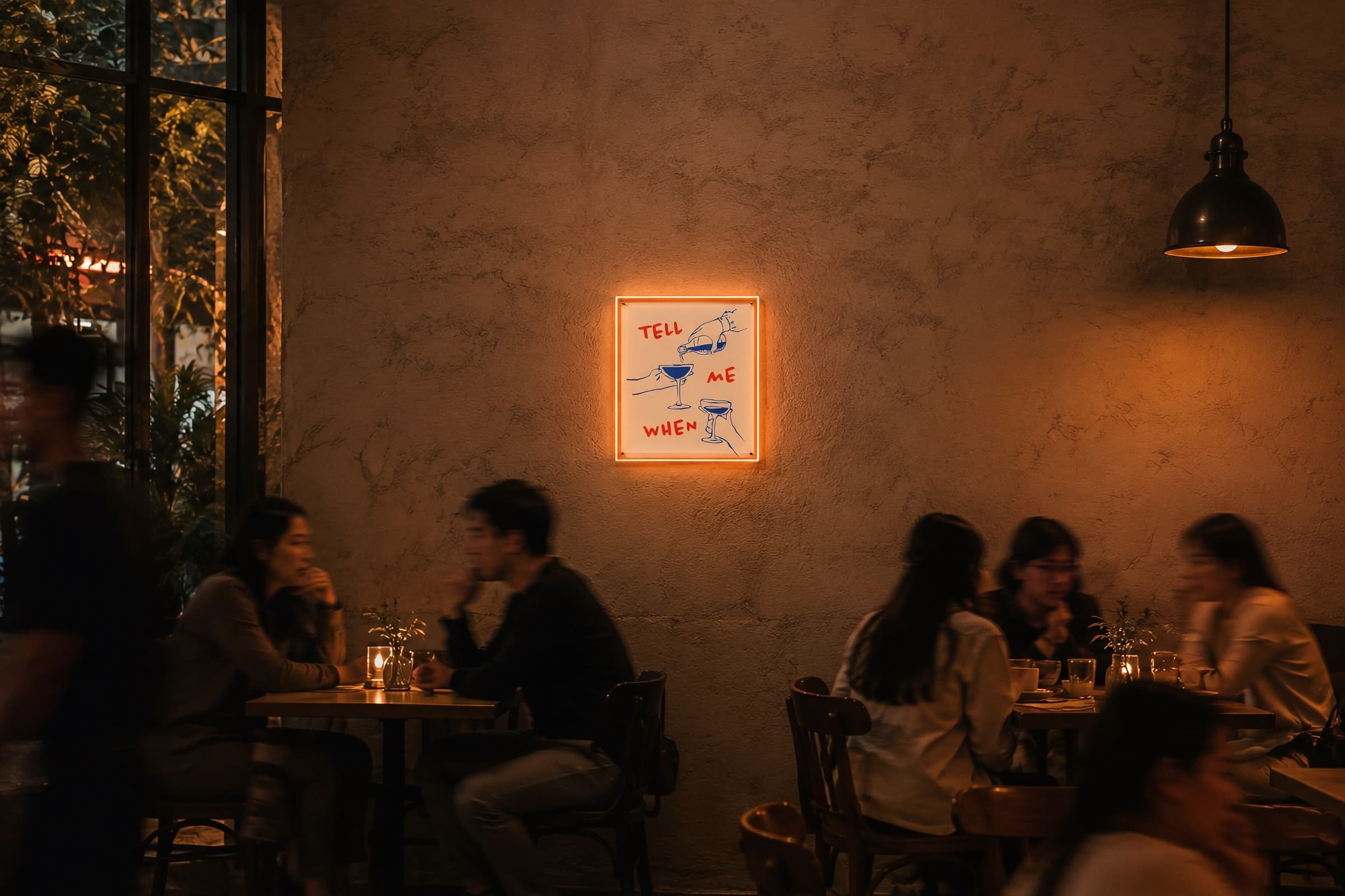 A Lemori print lit on a bar wall